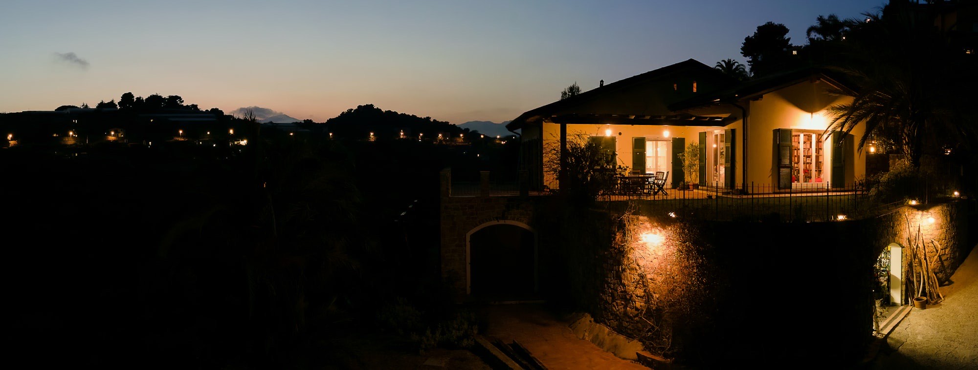 Home exterior glowing with warm light at dusk